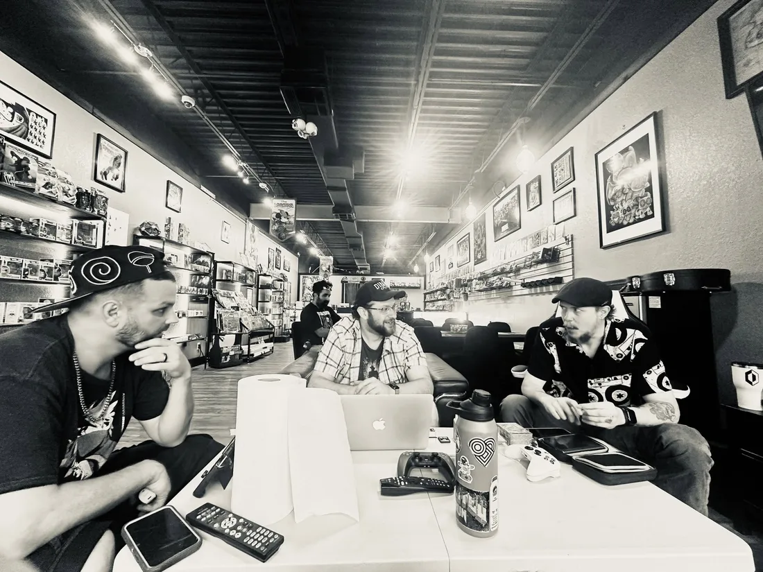 Inside Super Rare in Brandon, players hanging out around the table